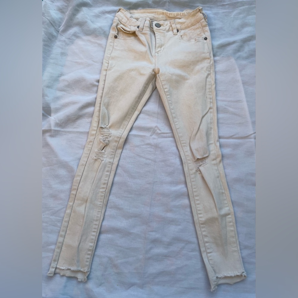 Cream Distressed Skinny Jeans